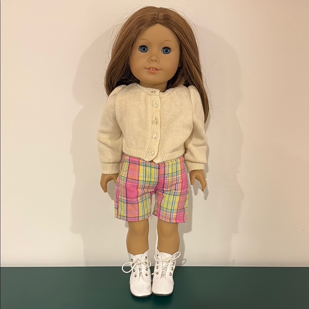 Pre-owned American Girl Doll with a summer outfit and a dress.